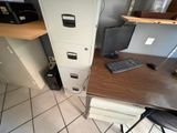 a desk with a keyboard and a monitor on it