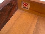 a close up of a wooden floor with a sign on it