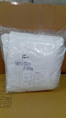 a bag of white paper sitting on top of a cardboard box