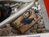 a bottle of alcohol and a lighter in a box
