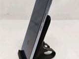a cell phone that is sitting on top of a stand
