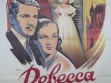 une vieille affiche de cinéma représentant un homme et une femme en robe blanche