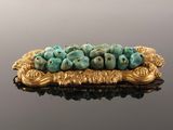 an image of a gold plate with a bunch of blue flowers on it