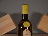 a bottle of wine that is sitting on a table