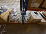 boxes of skis and ski poles are stacked on a pallet in a warehouse