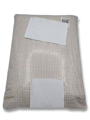 an image of a pillow with a white label on it