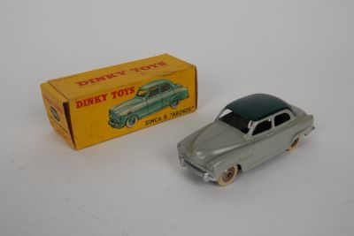 a toy car that is sitting next to a box