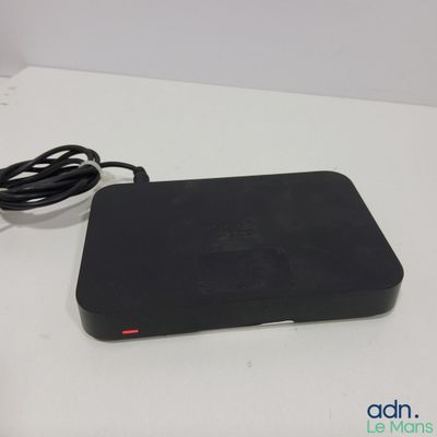 an image of a remote control sitting on top of a white table