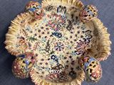 a small bowl with a floral design on it