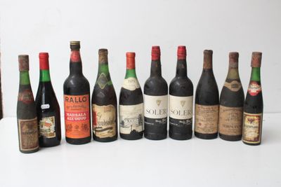 several bottles of wine are lined up in a row on a table