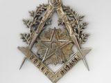 a masonic symbol on the wall of a building