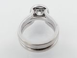 a close up of a ring with a diamond on it