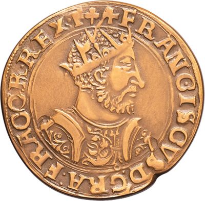 a close up of a gold coin with a crown on it