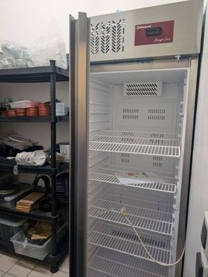 an image of a refrigerator in a kitchen with a lot of food