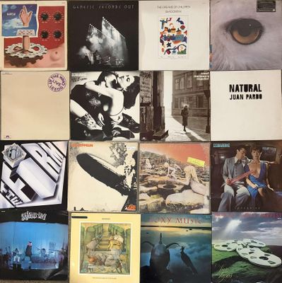 a lot of different album covers on the wall