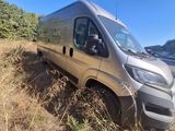 a silver van that is parked on the side of the road