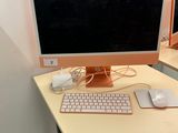 a desk with a computer, keyboard and mouse on it