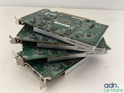 three computers are stacked on top of each other on a table