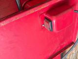 a red tool box with a hose attached to it