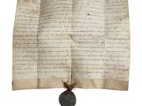 un vieux document muni d'un cachet de cire et sur lequel figure un cachet de cire