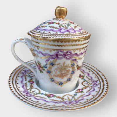 a cup and saucer on a saucer on a saucer