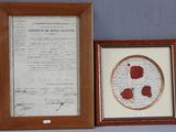 two framed photographs of a document and a framed picture of a flower