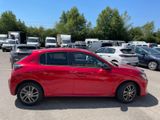 a red car that is parked in a parking lot