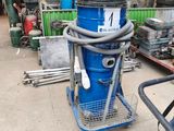 an image of a blue dust collector in a garage
