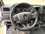 the interior of a car with a steering wheel and dashboard controls