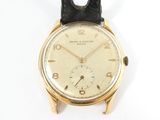 an image of a gold wrist watch on a white background