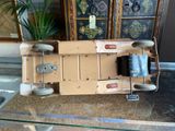 a toy truck that is sitting on a glass table