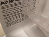 a white toilet with a plastic cover on it