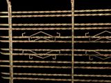 a close up of a metal rack with a bunch of metal rods