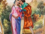 a vase with a painting of a man and a woman on it