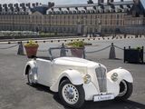 a white car that is parked in front of a building