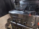 a commercial kitchen with stainless steel appliances in it