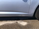 a silver car parked on the side of the road