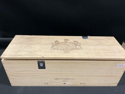 an open wooden box with a logo on it sitting on a table