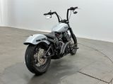 a motorcycle that is parked on the concrete floor