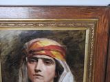 portrait of a woman in a turban in a wooden frame