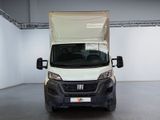 a white van that is parked in a room