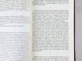 an open book on a table with a white background