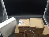 many boxes of electronic equipment sitting on the floor