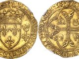 a gold coin with a cross on the front and a shield on the back