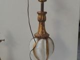 a lamp that is sitting on a table next to a lamp