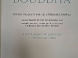 an open book with a picture of a buddha on it