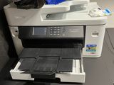a printer that is sitting on top of a desk
