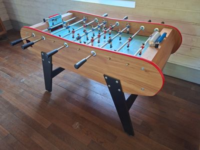 a foosball table in the corner of a room