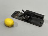 an image of a lemon and a machine on a table
