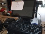 a keyboard and a mouse on a desk with a note attached to it